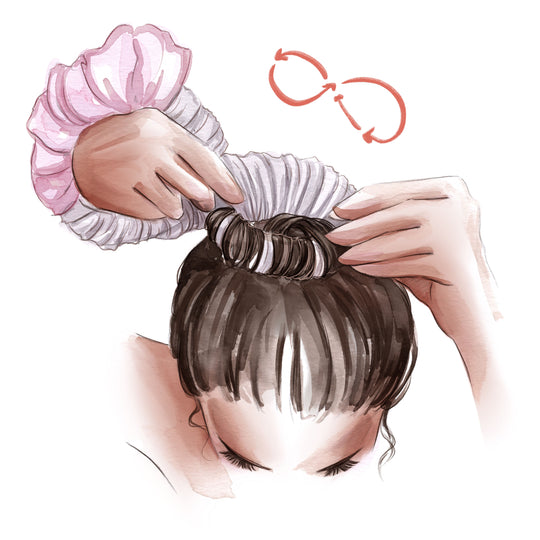 7. hold both sides of scrunchie and create a figure eight that results in a bun atop your head